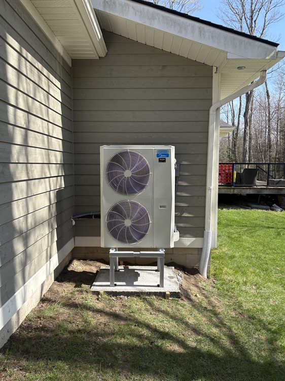 Heat pump installed on a raised deck